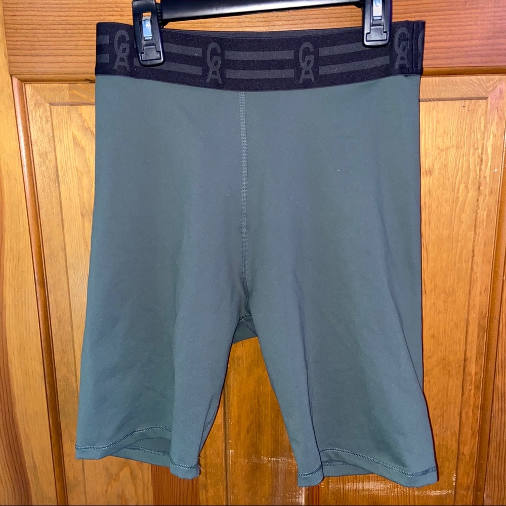Good American olive green bike shorts